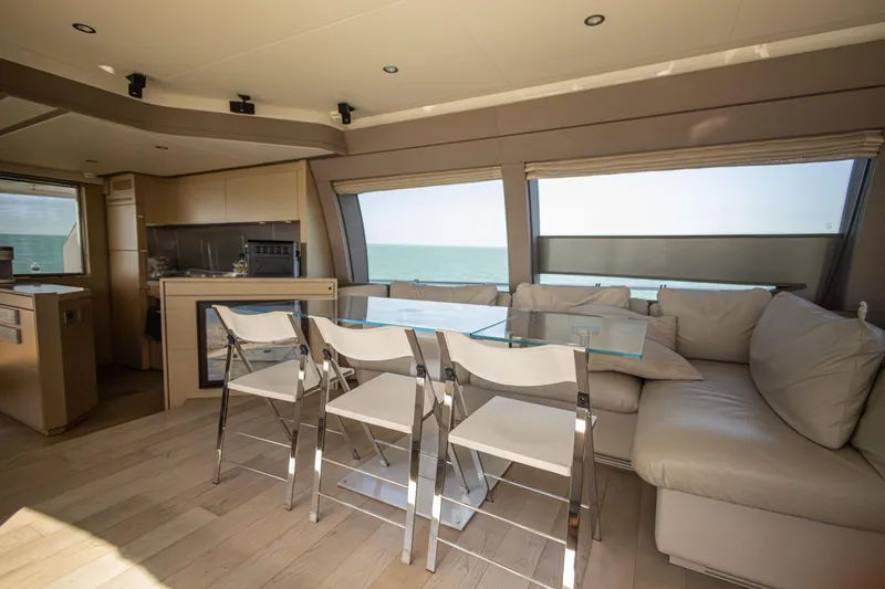 Navegante Yacht Photos Pics Luxurious interior of 2013 Ferretti Yachts 690 with modern dining area and ocean view.