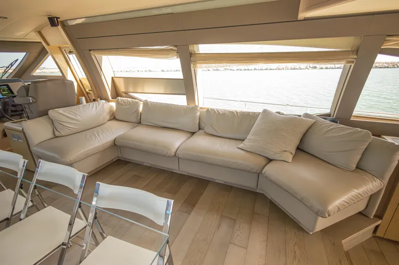 Navegante Yacht Photos Pics Luxurious interior of 2013 Ferretti Yachts 690 with plush seating and scenic window views.
