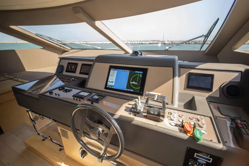 Navegante Yacht Photos Pics Cockpit of 2013 Ferretti Yachts 690 with advanced navigation controls and displays.