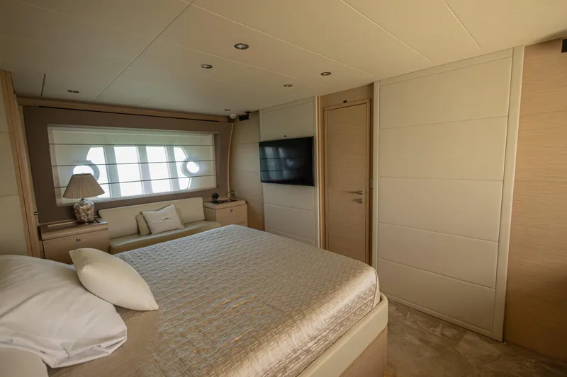 Navegante Yacht Photos Pics Luxurious bedroom interior of 2013 Ferretti Yachts 690 with elegant decor and modern amenities.