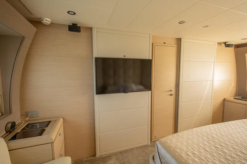 Navegante Yacht Photos Pics Luxurious interior of 2013 Ferretti Yachts 690 with modern TV and elegant furnishings.