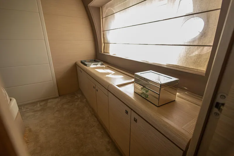 Navegante Yacht Photos Pics Luxurious interior of 2013 Ferretti Yachts 690 with elegant wood cabinetry and soft lighting.