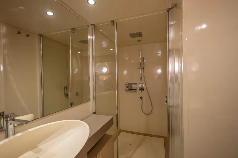 Navegante Yacht Photos Pics Luxurious bathroom interior of 2013 Ferretti Yachts 690 with modern fixtures and elegant design.