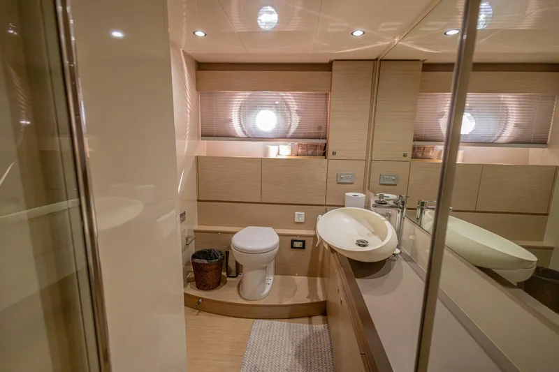 Navegante Yacht Photos Pics Luxurious bathroom in 2013 Ferretti Yachts 690, featuring modern fixtures and elegant design.