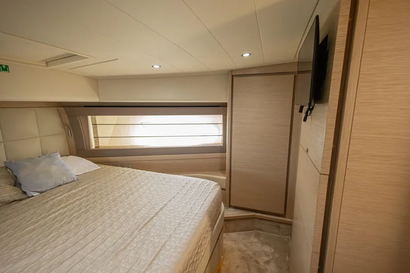 Navegante Yacht Photos Pics Luxurious bedroom interior of 2013 Ferretti Yachts 690 with modern design and cozy ambiance.