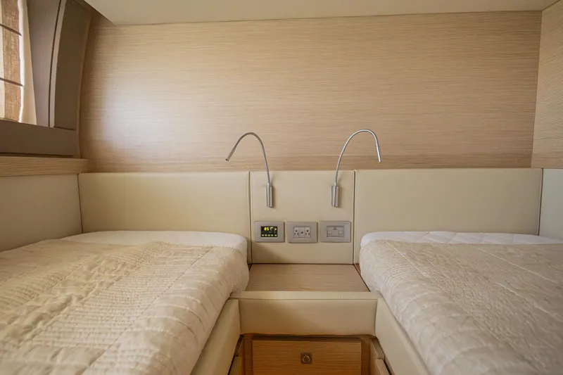 Navegante Yacht Photos Pics Luxurious twin cabin interior on 2013 Ferretti Yachts 690, featuring modern lighting and elegant design.