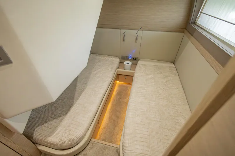 Navegante Yacht Photos Pics Luxurious twin cabin interior on 2013 Ferretti Yachts 690, featuring modern design and ambient lighting.