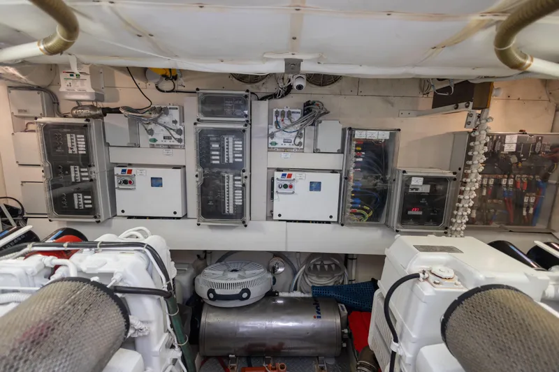 Navegante Yacht Photos Pics Engine room of a 2013 Ferretti Yachts 690, showcasing electrical panels and machinery.