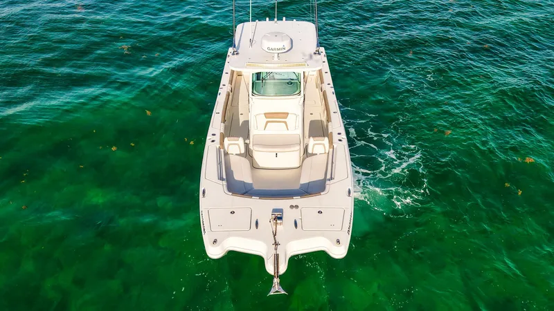 Complete Lunasea Yacht Photos Pics Aerial view of 2018 World Cat 320 CC boat on clear green water.