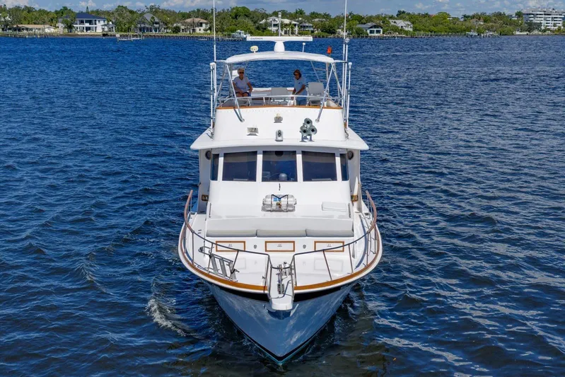  Yacht Photos Pics 1971 Matthews Voyager yacht cruising on a serene blue lake.
