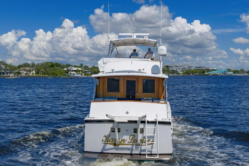  Yacht Photos Pics Classic 1971 Matthews Voyager yacht cruising on a sunny day with scenic coastal backdrop.