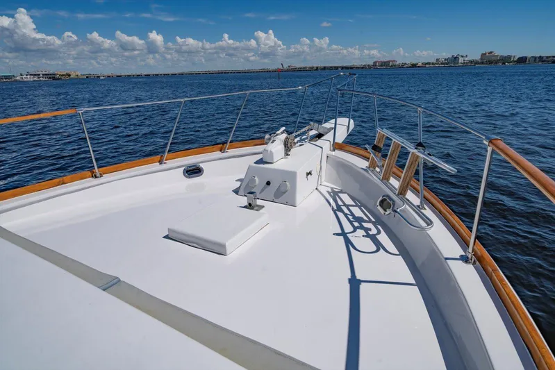  Yacht Photos Pics 1971 Matthews Voyager yacht deck with wooden railings on a sunny day.