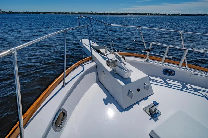  Yacht Photos Pics 1971 Matthews Voyager boat deck with railing, cruising on calm blue waters.