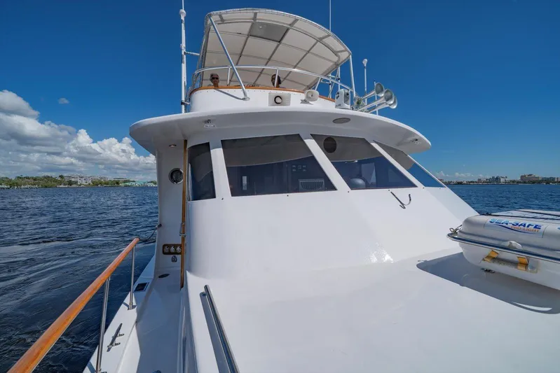  Yacht Photos Pics 1971 Matthews Voyager yacht cruising on a sunny day with clear blue skies.