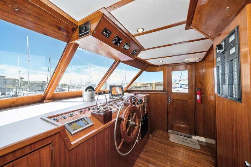  Yacht Photos Pics 1971 Matthews Voyager boat helm with wooden interior and navigation equipment.