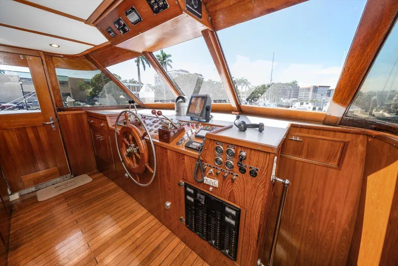  Yacht Photos Pics 1971 Matthews Voyager boat helm with wooden interior and navigation controls.