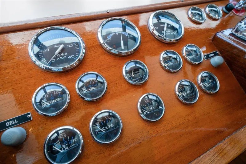  Yacht Photos Pics 1971 Matthews Voyager dashboard with various gauges on polished wood panel.