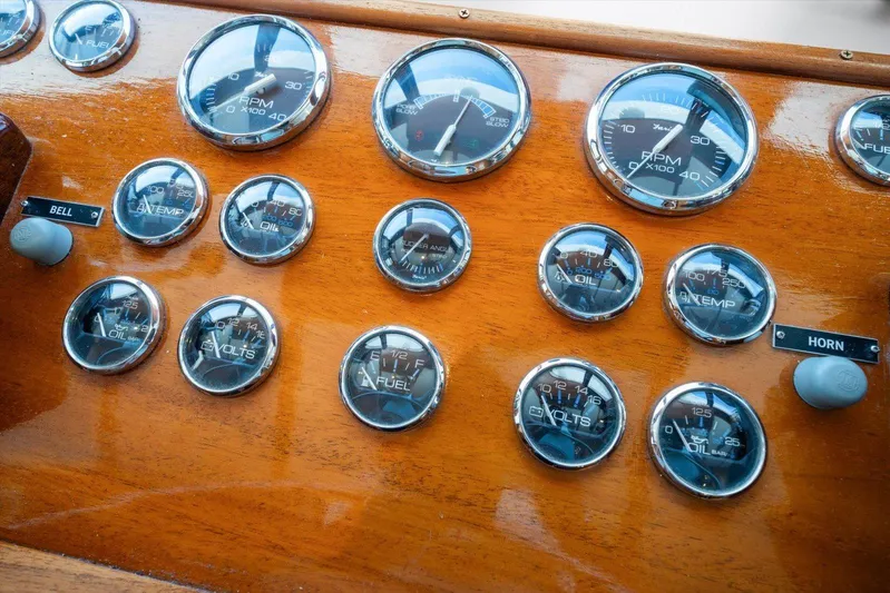  Yacht Photos Pics Vintage 1971 Matthews Voyager dashboard with gauges and controls on polished wood panel.