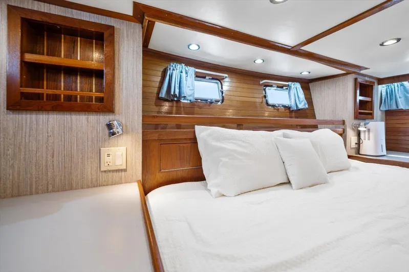  Yacht Photos Pics Luxurious 1971 Matthews Voyager cabin interior with cozy bed and wooden accents.