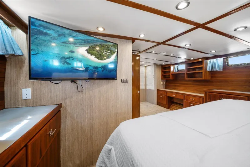  Yacht Photos Pics Luxurious 1971 Matthews Voyager yacht interior with wood paneling and mounted TV.