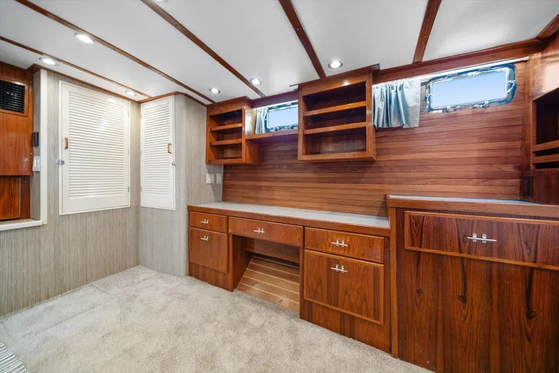  Yacht Photos Pics 1971 Matthews Voyager interior with wooden cabinetry and carpeted flooring.