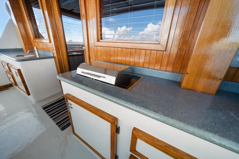  Yacht Photos Pics 1971 Matthews Voyager yacht interior with wooden cabinetry and modern countertop grill.