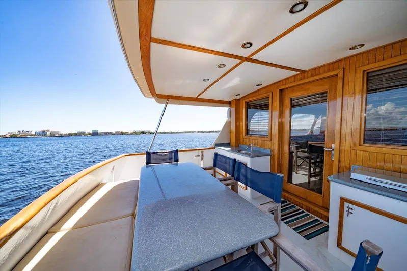  Yacht Photos Pics 1971 Matthews Voyager yacht deck with seating, wooden accents, and ocean view.