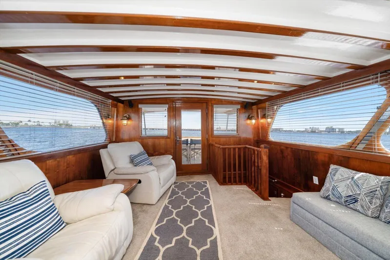  Yacht Photos Pics Luxurious interior of a 1971 Matthews Voyager yacht with elegant wood paneling and waterfront views.