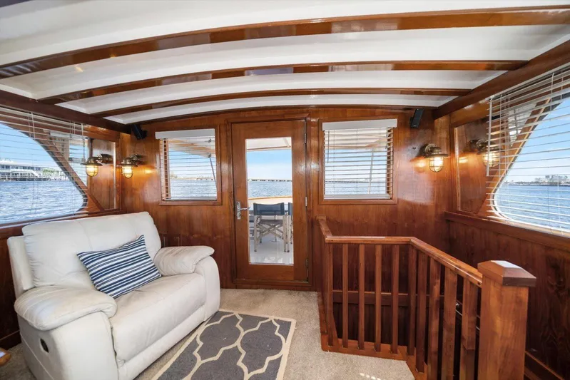  Yacht Photos Pics 1971 Matthews Voyager yacht interior with wood paneling, white sofa, and nautical decor.