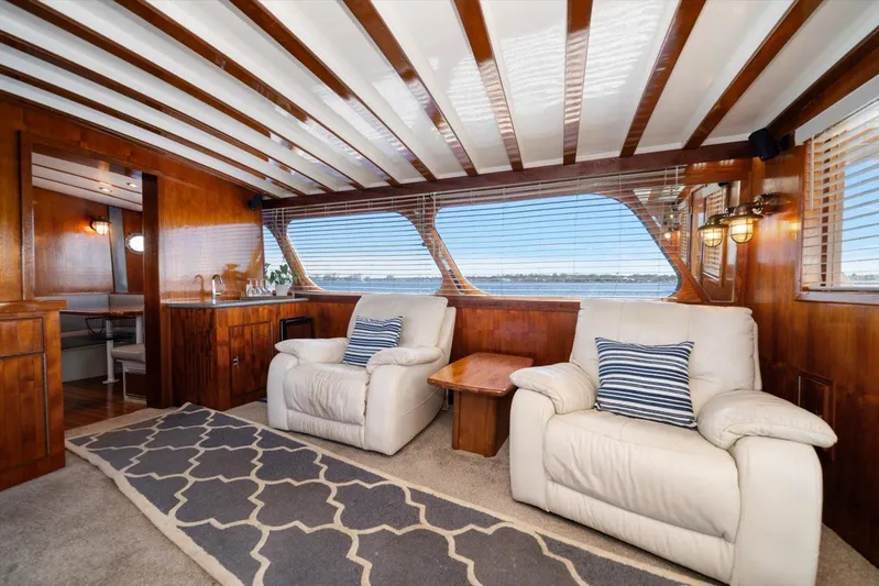  Yacht Photos Pics Luxurious 1971 Matthews Voyager yacht interior with plush seating and elegant wood paneling.