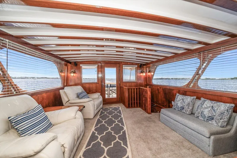  Yacht Photos Pics Luxurious 1971 Matthews Voyager yacht interior with plush seating and panoramic windows.