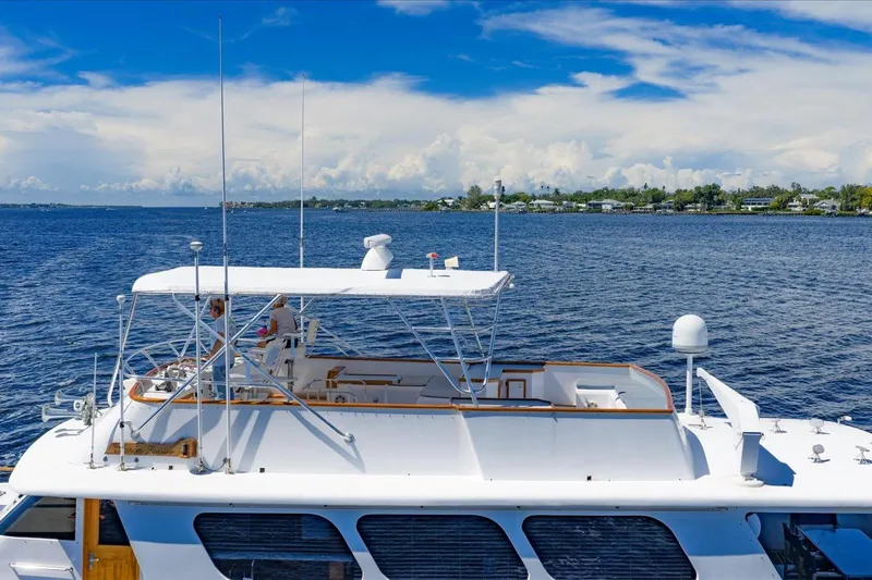  Yacht Photos Pics 1971 Matthews Voyager yacht cruising on a sunny day with clear blue skies.