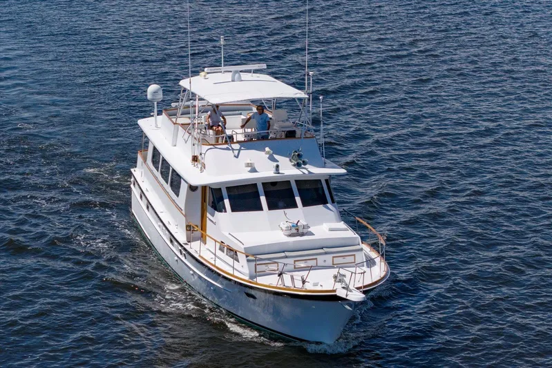  Yacht Photos Pics 1971 Matthews Voyager yacht cruising on open water, featuring classic design and spacious deck.