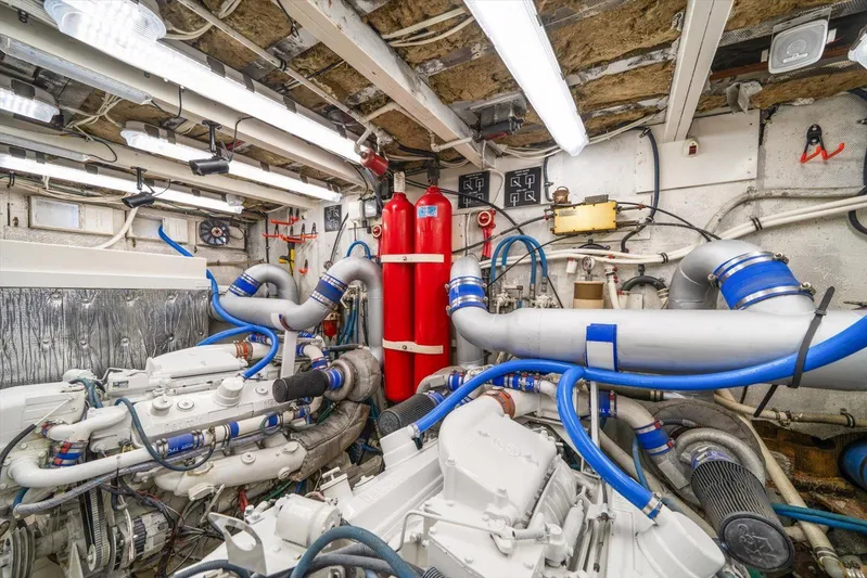  Yacht Photos Pics Engine room of a 1971 Matthews Voyager boat, featuring complex machinery and piping.