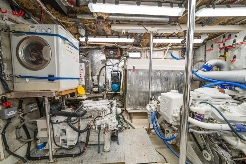  Yacht Photos Pics Engine room of a 1971 Matthews Voyager boat with machinery and equipment.