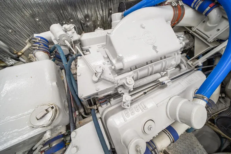  Yacht Photos Pics Engine of a 1971 Matthews Voyager with blue hoses and metallic components.