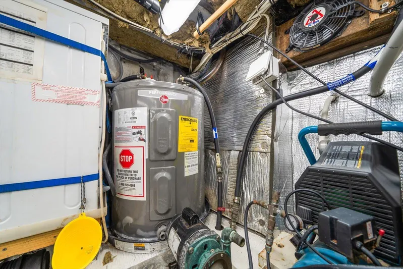  Yacht Photos Pics Engine room of a 1971 Matthews Voyager boat with equipment and wiring.