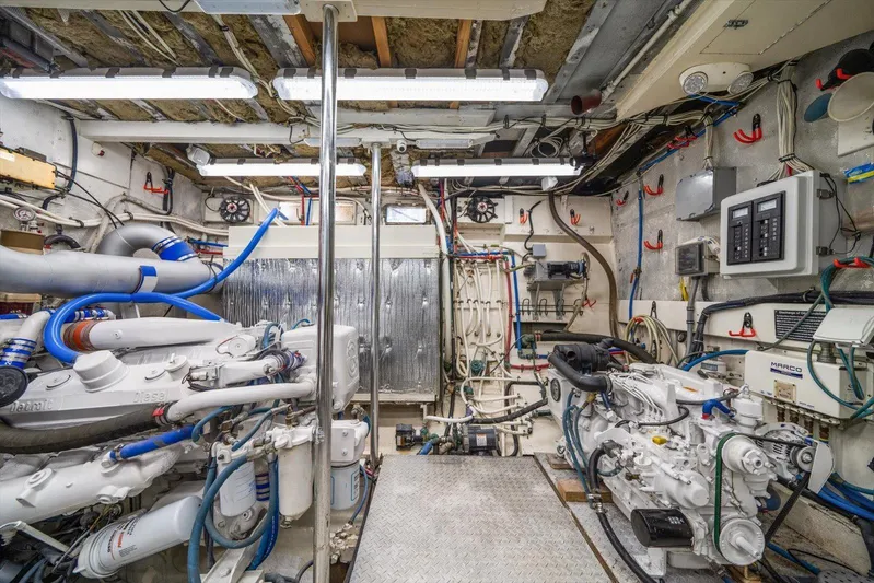  Yacht Photos Pics Engine room of a 1971 Matthews Voyager boat, featuring complex machinery and wiring.