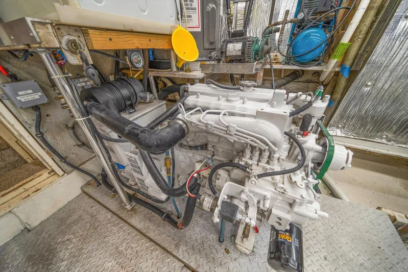  Yacht Photos Pics Engine room of a 1971 Matthews Voyager boat, showcasing mechanical components and wiring.