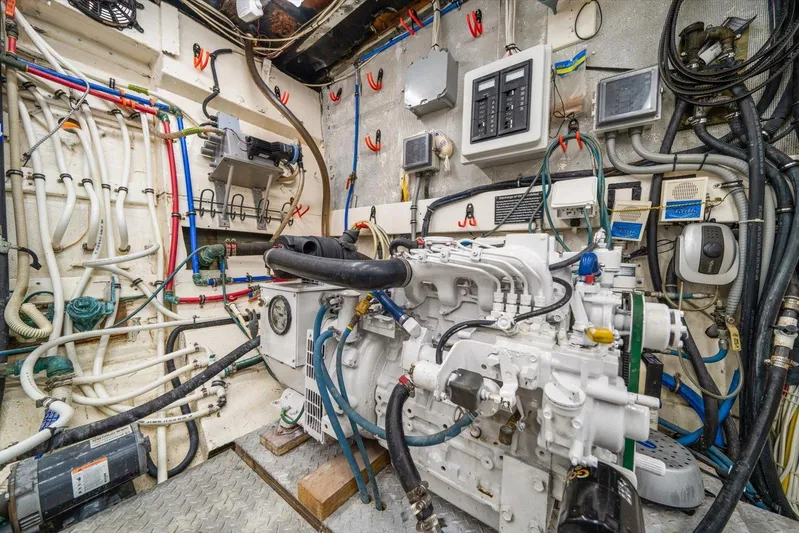  Yacht Photos Pics Engine room of a 1971 Matthews Voyager boat, featuring complex wiring and machinery.