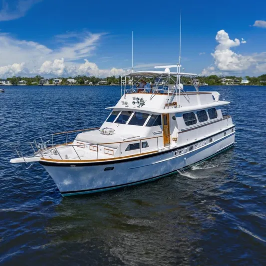  Yacht Photos Pics 1971 Matthews Voyager yacht cruising on a sunny day with clear blue skies.