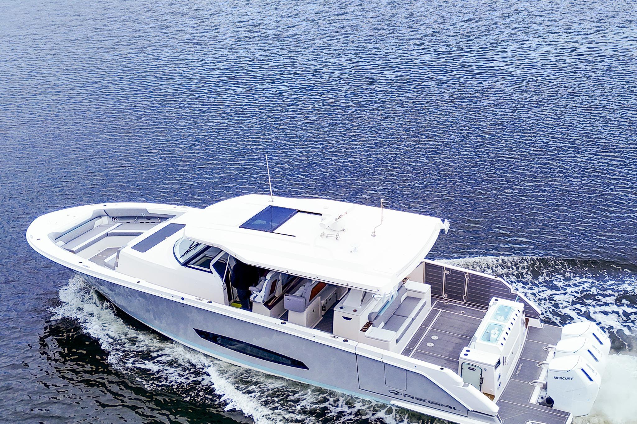 2025 Regal 50 SAV luxury yacht cruising on open water.