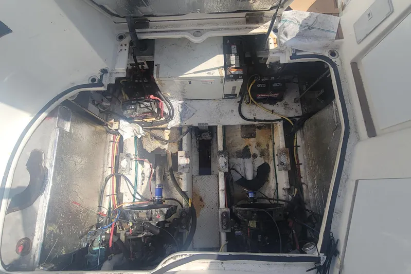 Grandcru Yacht Photos Pics Engine compartment of a 2005 Cruisers Yachts 340 Express, showing wiring and battery setup.