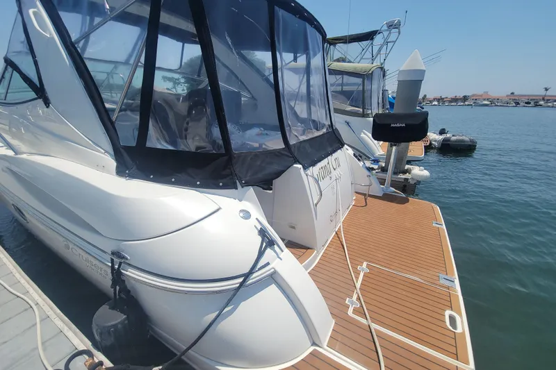 Grandcru Yacht Photos Pics 2005 Cruisers Yachts 340 Express docked, featuring sleek design and spacious deck.