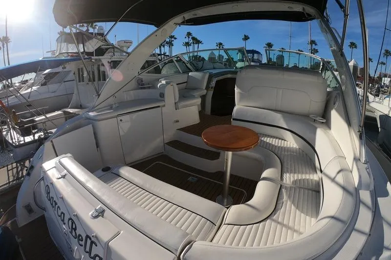 Grandcru Yacht Photos Pics 2005 Cruisers Yachts 340 Express interior with white seating and wooden table.