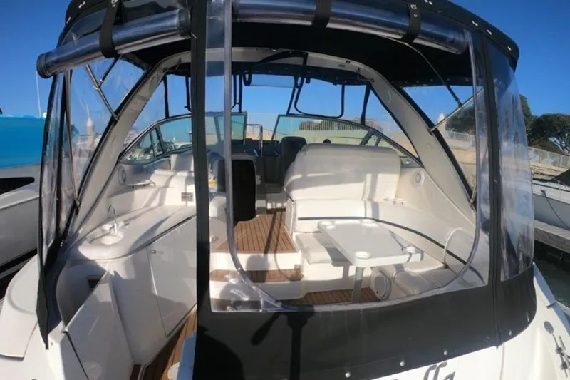 Grandcru Yacht Photos Pics 2005 Cruisers Yachts 340 Express interior with seating and table, featuring clear canopy.