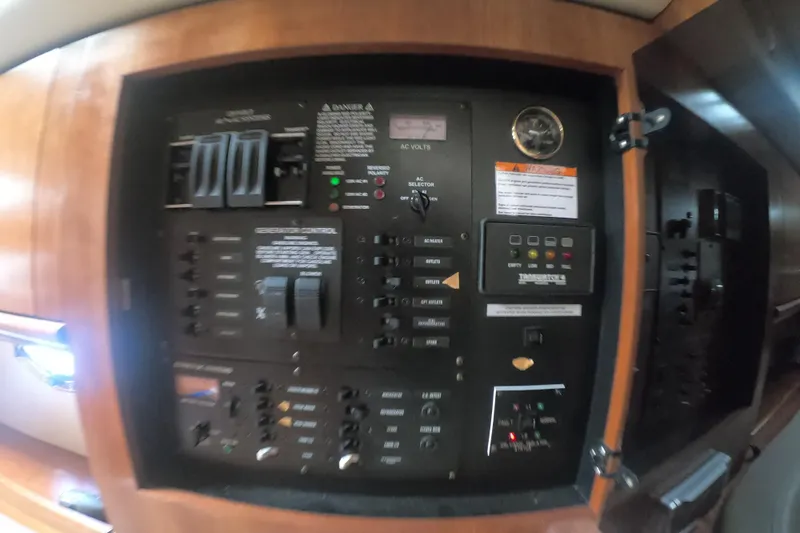 Grandcru Yacht Photos Pics Electrical control panel inside 2005 Cruisers Yachts 340 Express boat cabin.