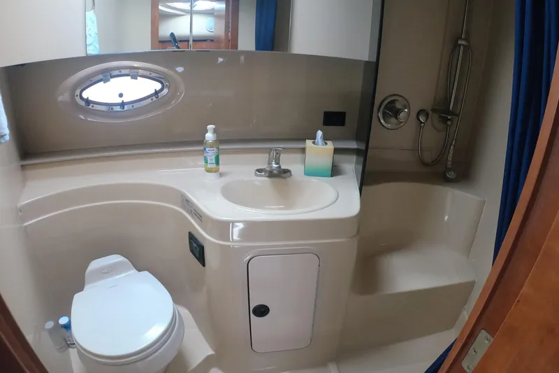 Grandcru Yacht Photos Pics Bathroom interior of 2005 Cruisers Yachts 340 Express with sink, toilet, and shower.