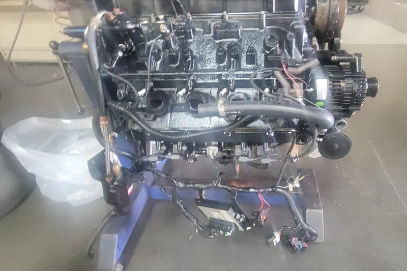 Grandcru Yacht Photos Pics Engine of a 2005 Cruisers Yachts 340 Express, detailed view in a workshop setting.