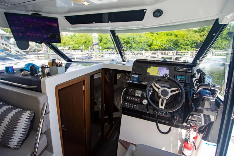 Sea Scape Yacht Photos Pics Interior of 2021 Jeanneau NC 1095 boat with modern helm and navigation equipment.